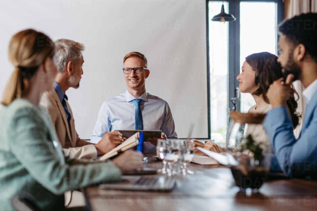 young colleagues having casual discussion during business meeting in office group of men and women sitting in conference room hpif32325 1 1024x682